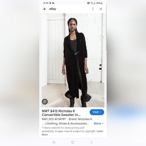 NICHOLAS K CONVERTABLE SWEATER.black size large.. notags..but new and never worn